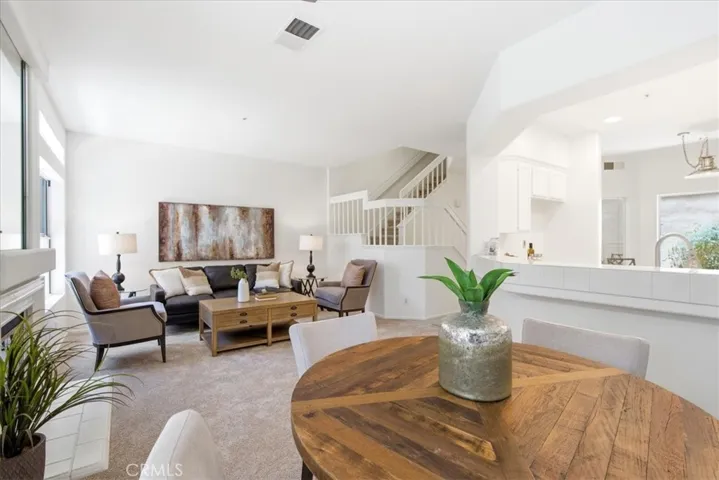 Additional living space emphasizing bright, airy interior design.