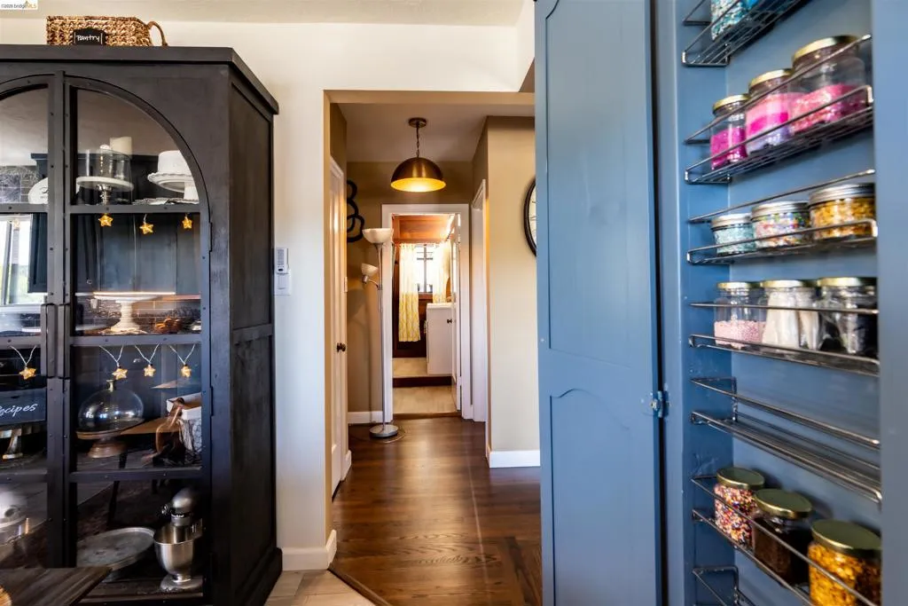 Hallway to bedrooms and bathroom with dark walnut-finish hardwood flooring, and a recessed ceiling light fixture