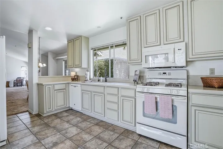 Tastefully updated kitchen with ample natural light and gas stove