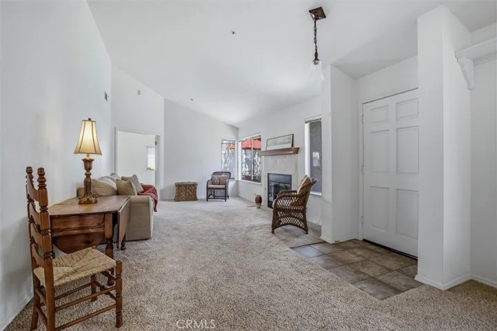Open concept living room, vaulted ceilings and natural light