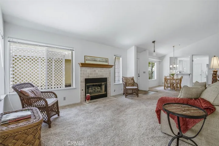 Front living room with fireplace, vaulted ceilings, near foyer and open floorpan