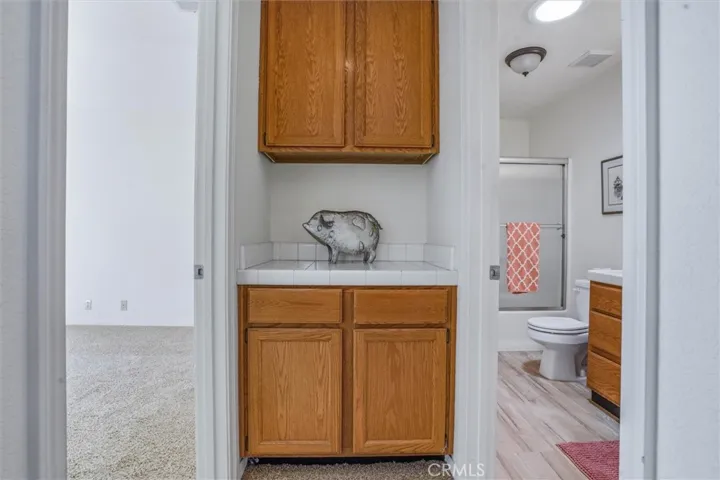 Built-in hall storage with access to guest room and full bathroom