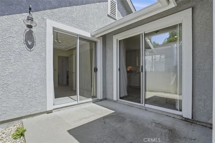 Side patio with access to bedroom and main living area