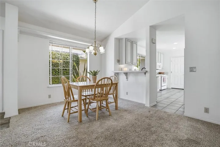 Dining room with vaulted ceilings and tons of natural light