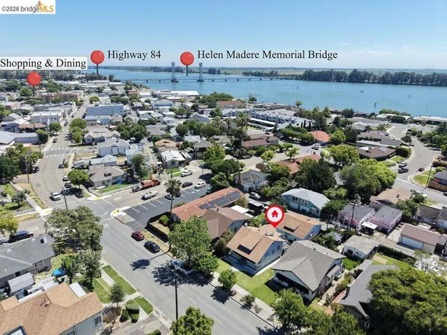 Aerial perspective showcasing residential properties and a visible waterway