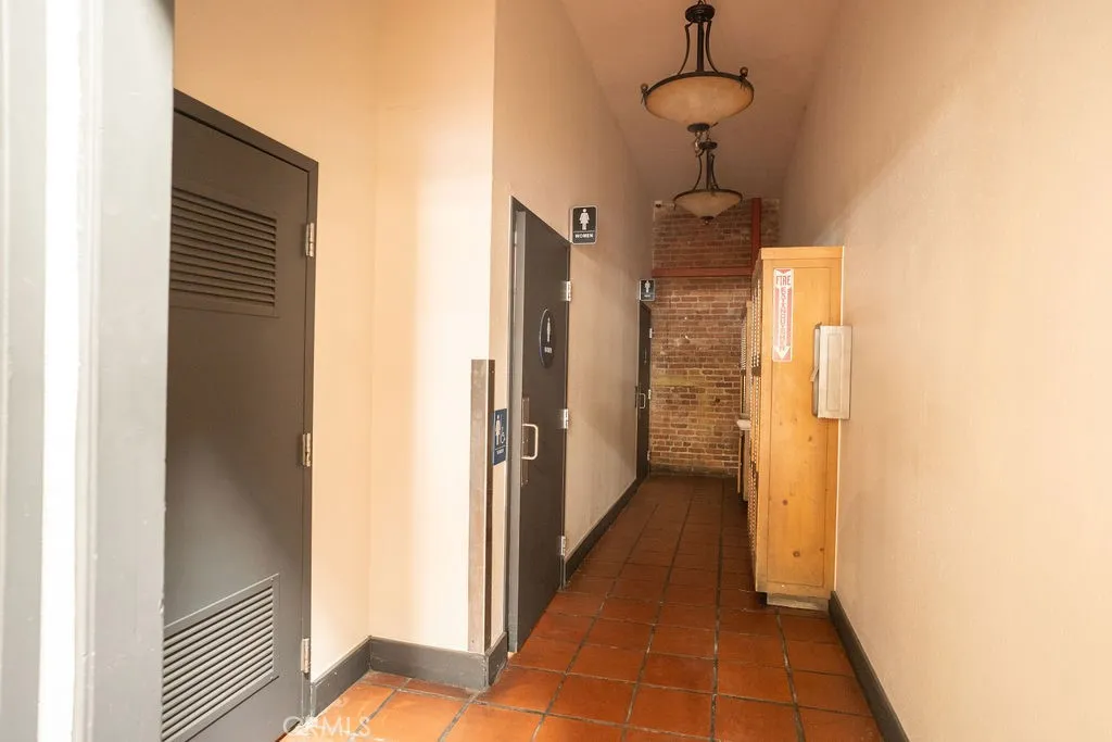 Hall to bathrooms/Utility closet/storage lockers Hall to bathrooms/Utility closet/storage lockers