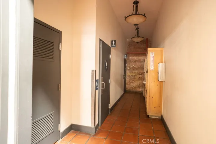 Hall to bathrooms/Utility closet/storage lockers