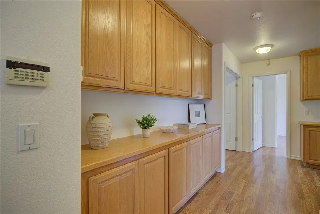 Hallway leading to primary suite and two bedrooms