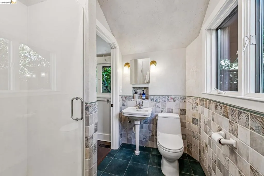 Bathroom features beautiful hand done plaster walls.