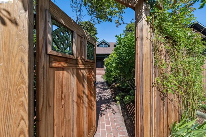 Upon entering the front gate you will immediately be enveloped by the lovely garden, home to pollinators and beautiful fruit trees!