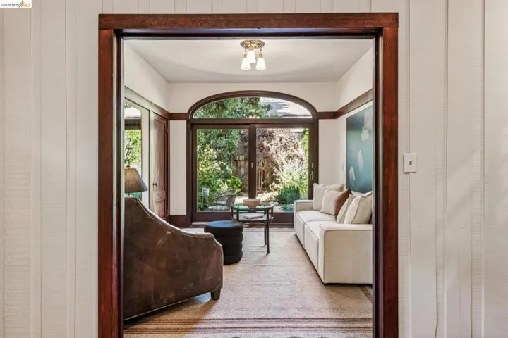 Formerly the third bedroom this room is open to the kitchen and opens directly back to the incredible backyard.