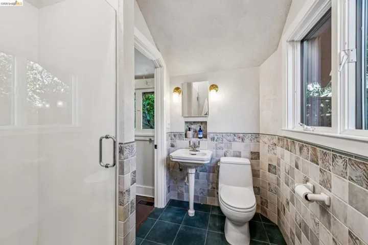 Bathroom features beautiful hand done plaster walls.
