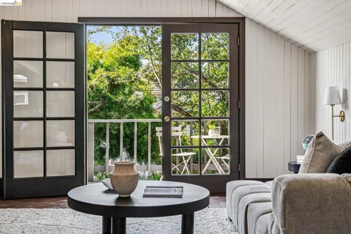 French doors wopening out to the deck from the attic.