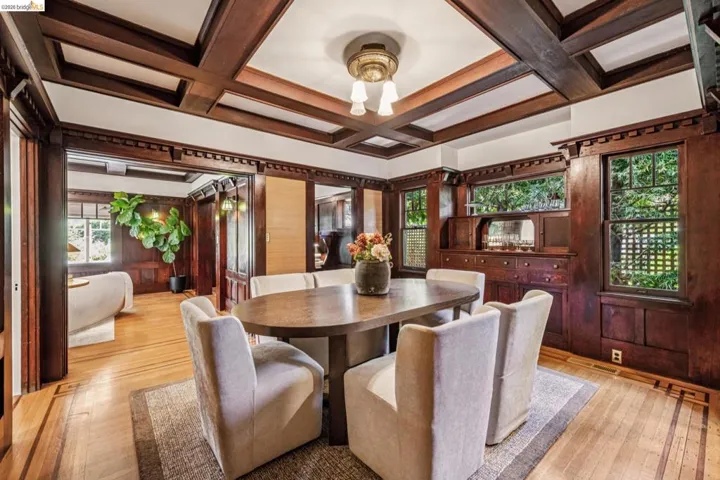 Coffered ceiling detail over wood-finish flooring with decorative inlay