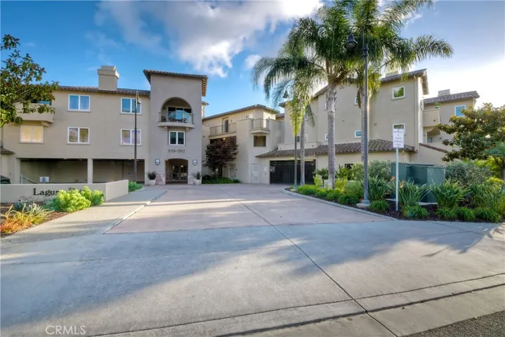 Welcome to Laguna Pt. with curb appeal galore and a fabulous Ttopical Mediterranean resort vibe.