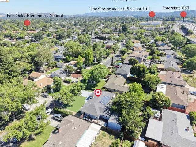 Aerial perspective showcasing a residential neighborhood with mature trees