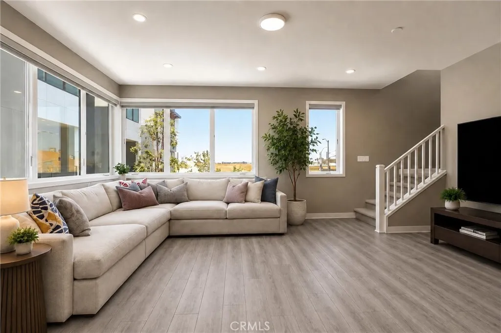high ceilings and oversized windows bring an abundance of natural and artificial light