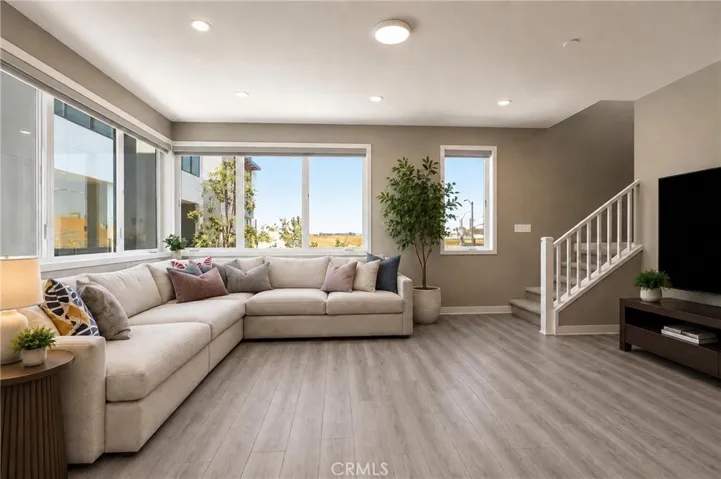 high ceilings and oversized windows bring an abundance of natural and artificial light