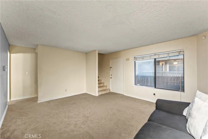 Unstaged living room offers generous space and open layout.