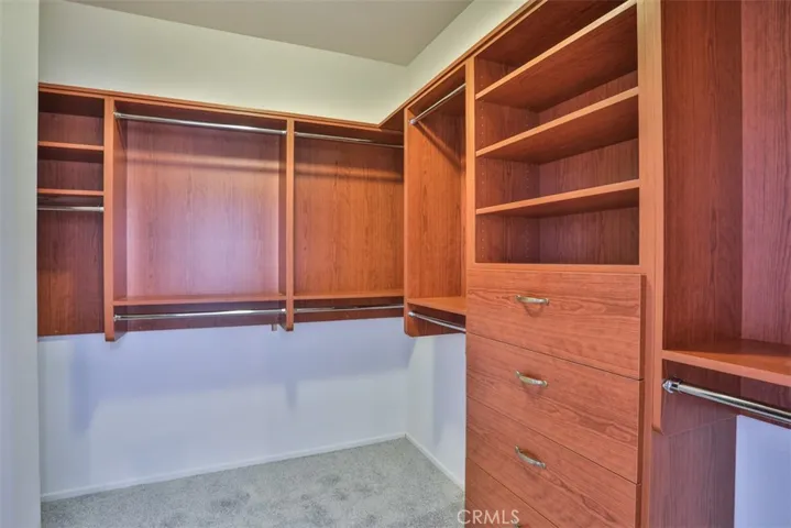 Two walk-in closets in primary bedroom