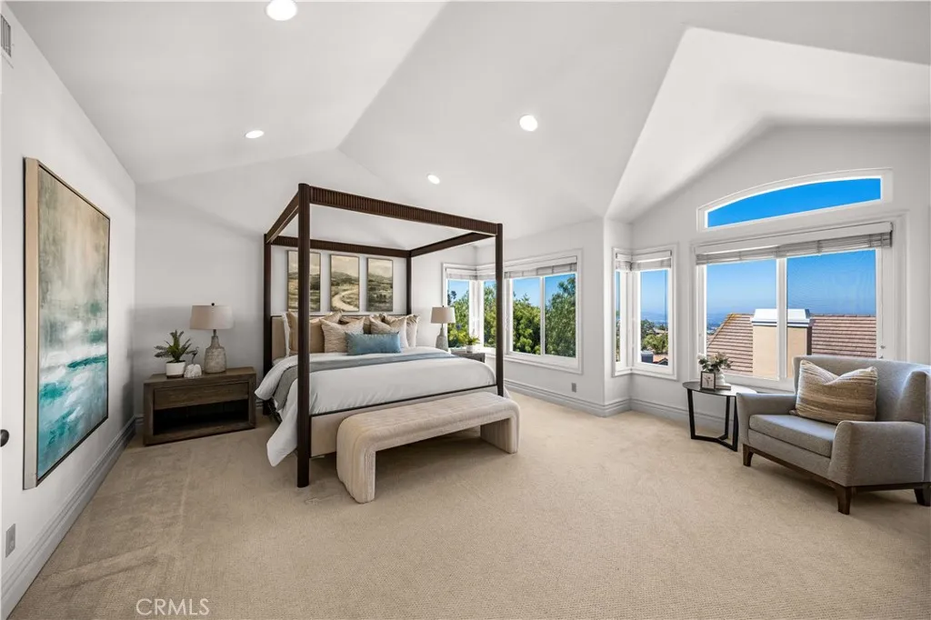 Primary bedroom has city lights/sunset view