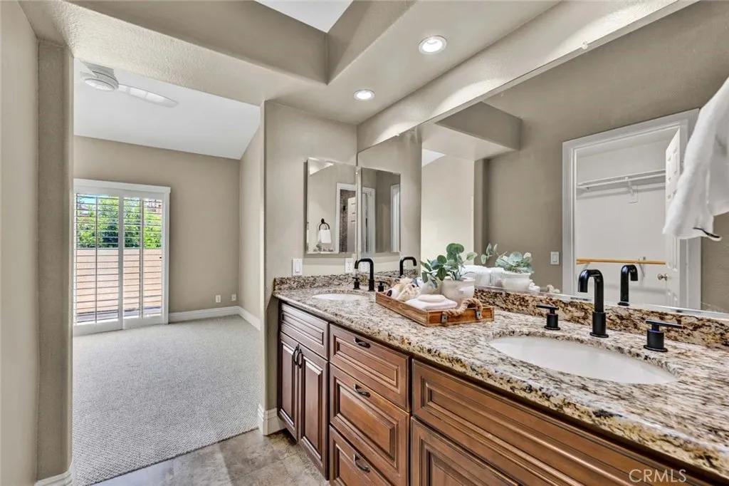 Custom wood cabinets, recessed lighting, and newly installed fixtures.