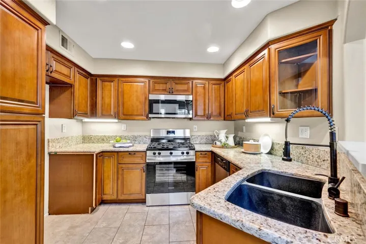 Brand new stainless steel appliances included in the kitchen.