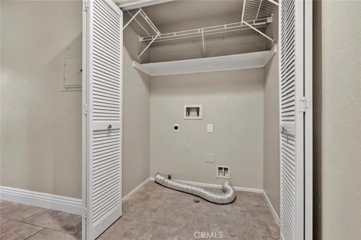 Convenient, full-sized laundry closet located on the upper level.