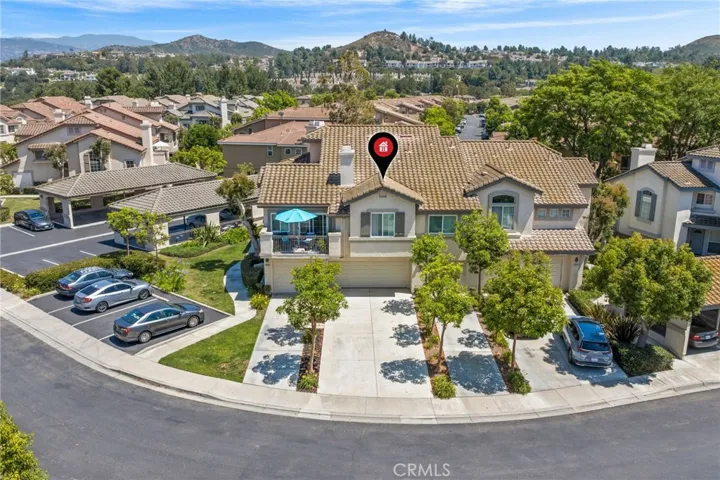 This beautiful end unit features a rare and highly desirable four-car driveway, providing ample parking space and added privacy.