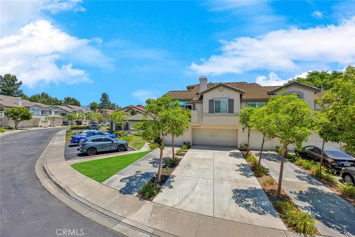 Spacious four-car driveway offering ample parking and convenient property access.