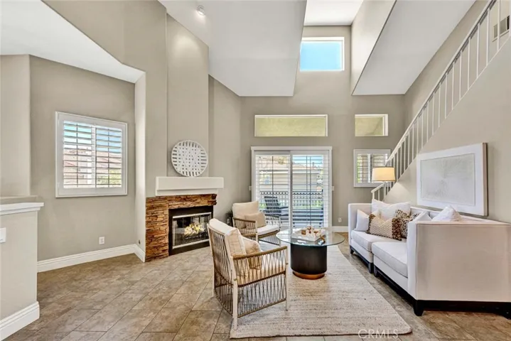 Soaring cathedral ceilings and an abundance of windows create a bright and airy living space.
