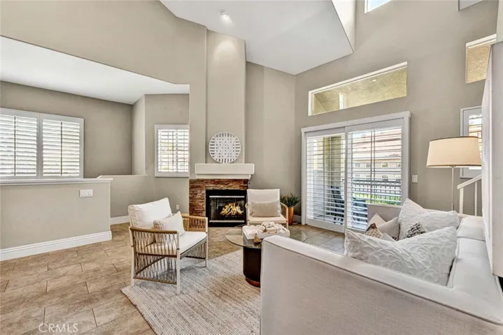 Move-in ready interior featuring custom plantation shutters and abundant natural light.