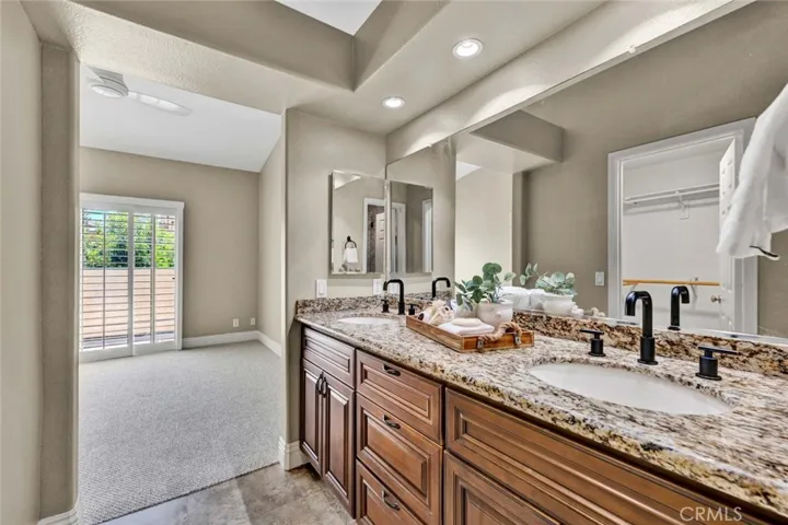 Custom wood cabinets, recessed lighting, and newly installed fixtures.
