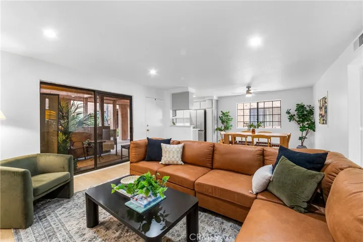 Open concept space with large sliding door leading to your private patio.  Enjoy new Mohawk flooring, new lighting, remodeled kitchen and much more in this gorgeous condo!