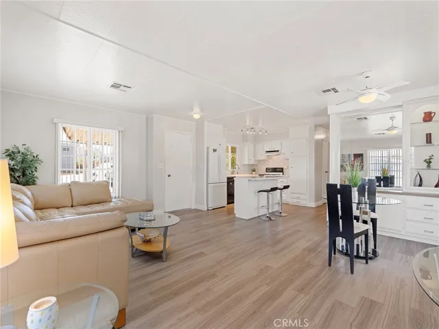 Living room, kitchen, dining area, bar cabinet