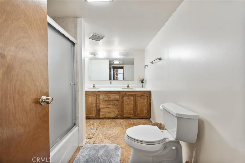 Extra large bathroom with dual sinks and tiled shower.  Newly renovated.