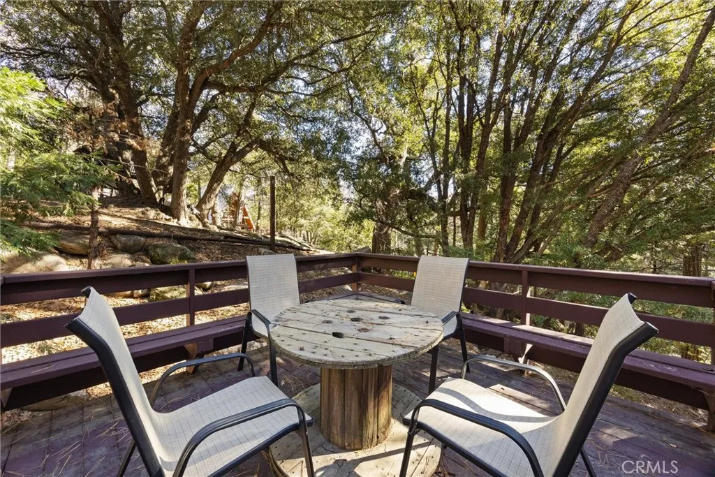 Seating area below top deck.  Great for enjoying the view and trees.