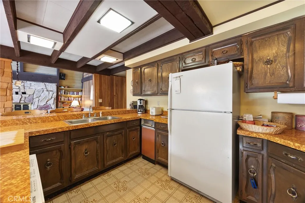 Wood cabinetry with newer appliances