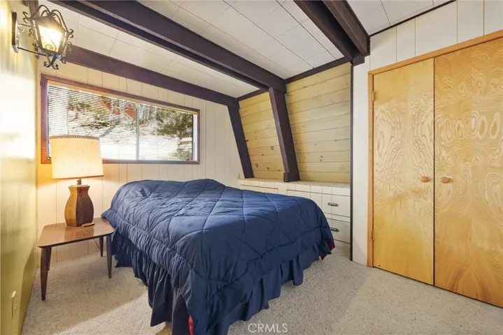 Bedroom #2 downstairs, with large closet and built-in drawers.