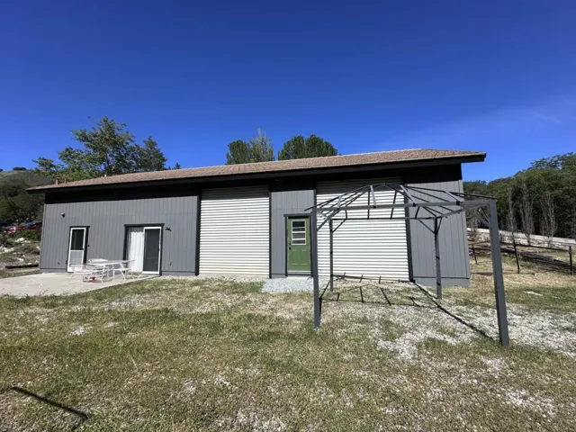 Shop with 2 bay doors and a 2 bedroom 1 bath guest unit.