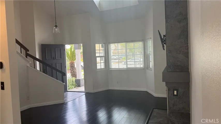 Dining-room looking towards living-room, full of natural light