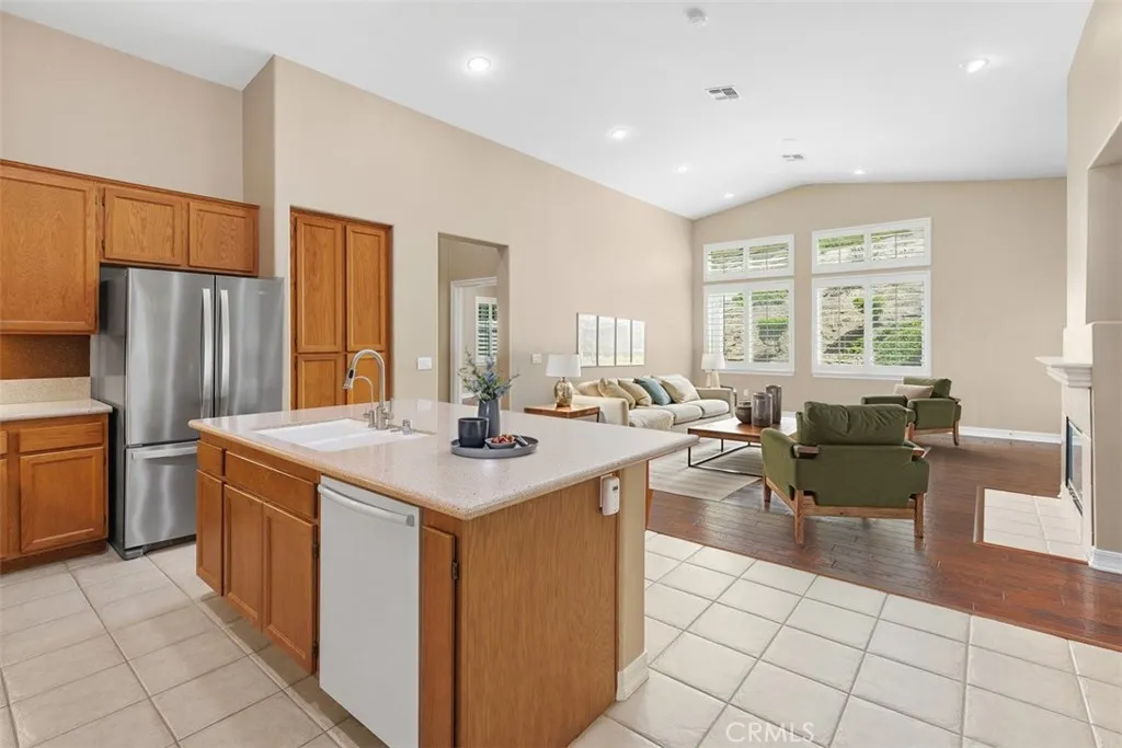 Kitchen opens to family room. Virtually staged.
