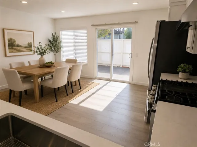 Kitchen/Dining Room - AI Virtually Staged Photo. Furniture, décor, furnishings, and/or accessories have been digitally added for illustrative purposes and are not included with the property.