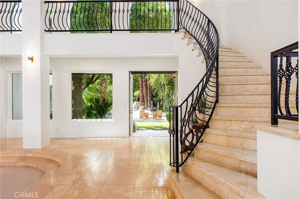 stairs to 2nd primary with on suite, bar and balcony