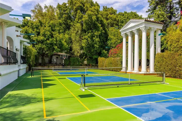 full competition tennis court is also marked off for 2 competition size pickleball courts with roll-on nets and there is also a Dominator basketball setup
