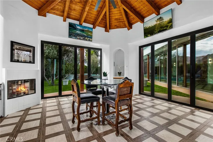 rotunda is between the pool and tennis court- it has 3 seperate accordian doors, a kitchenette, 4 TVs, 3 wine fridges