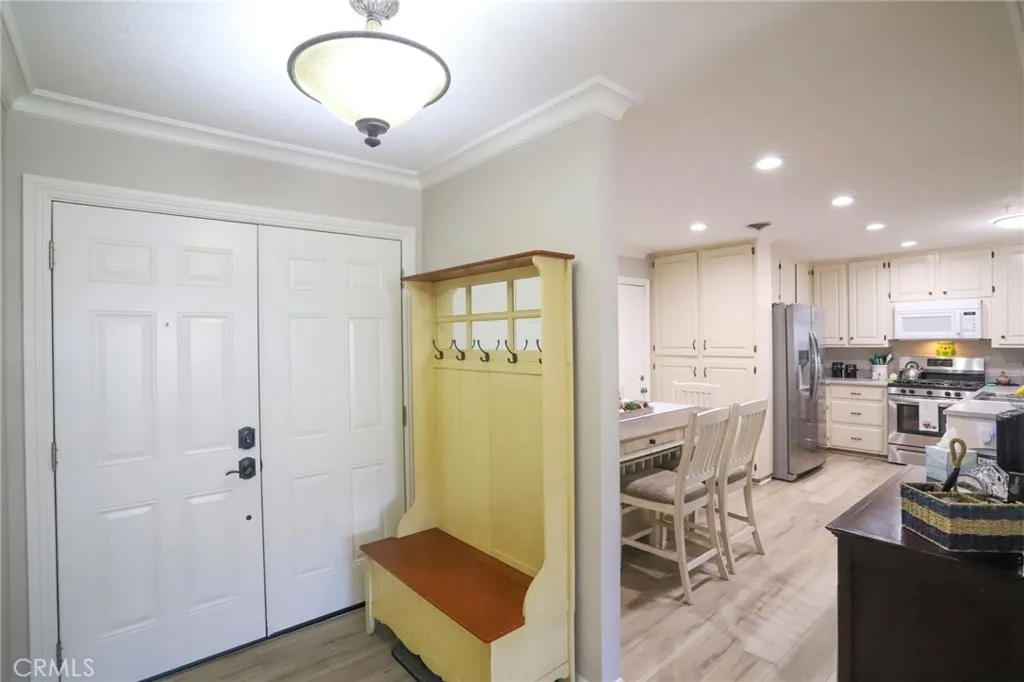 View overlooking the entrance, dining area and kitchen from living room