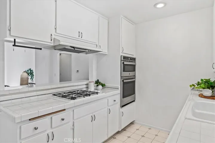Kitchen facing stove and Kitchen bar