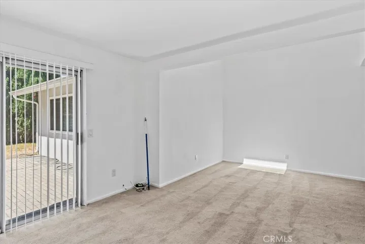 Family room facing sliding door/back yard