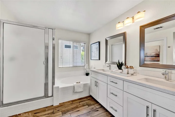 Main Bathroom with separate bath tub and shower and double sinjks